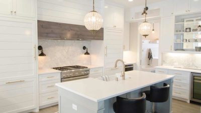 modern kitchen remodeling project with hanging light fixtures